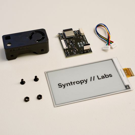 Aether Essential Hardware Kit laid out: SEN66 sensor, PCB, cable, screws and 3.7-inch e-paper display